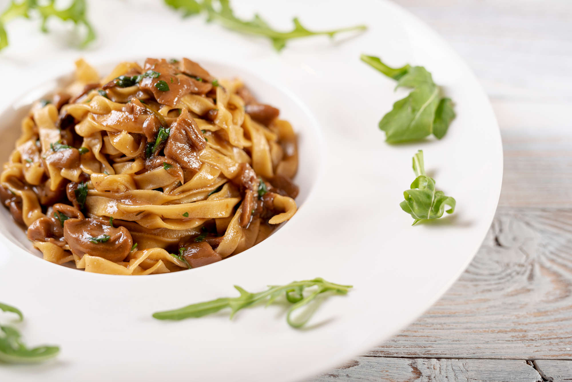 Pasta dish with mushrooms — earthy, umami-rich pizza toppings like mushrooms call for wines with similar depth