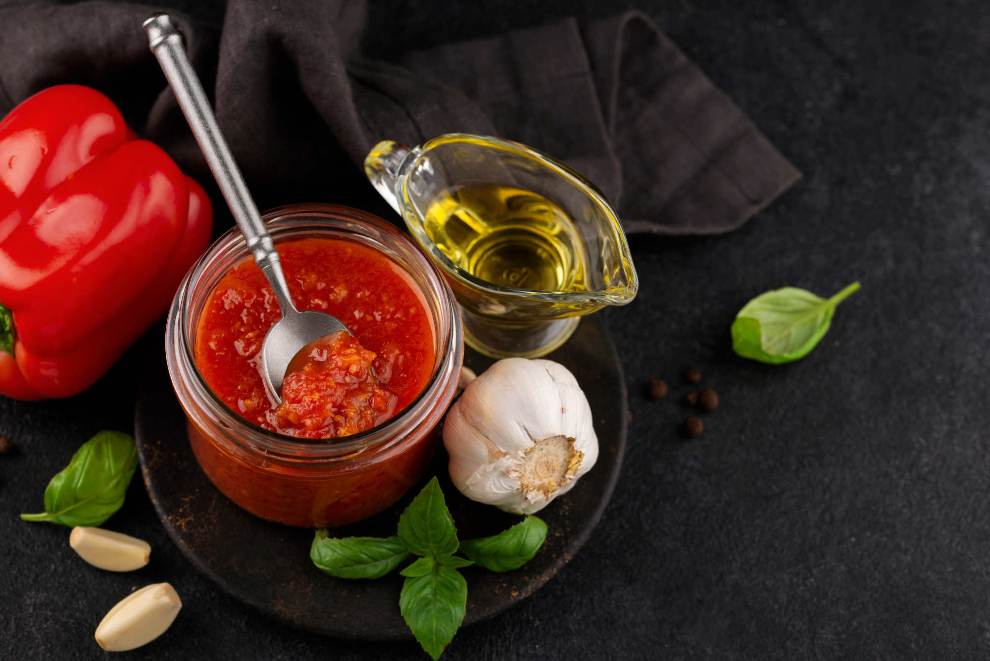 A rich tomato and meat sauce in a pan — wine is added to bolognese and marinara sauces early in cooking to give the alcohol time to cook off