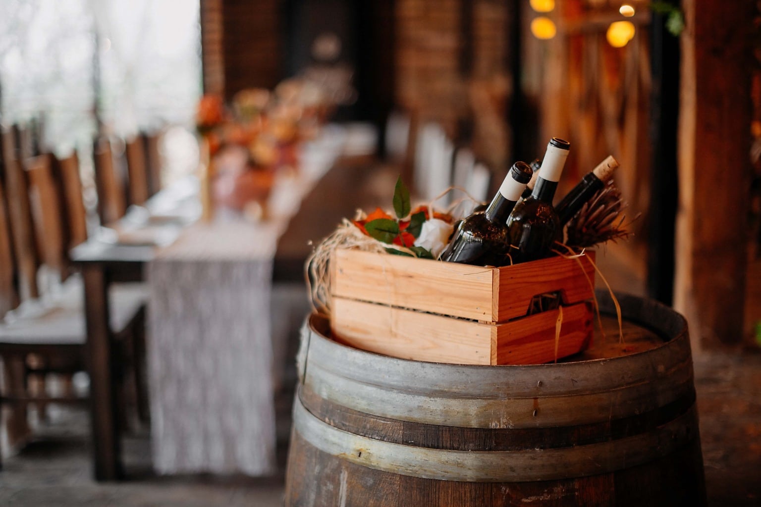 Wine bottles on a table — the style of Chardonnay in the glass, oaked or unoaked, determines which foods will work best alongside it
