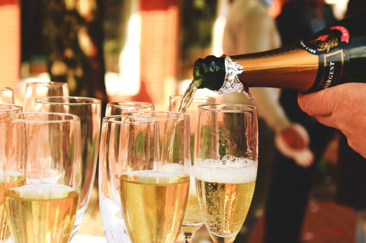 A glass of Champagne — the great Champagne houses of France each developed a distinct style over centuries, from Bollinger's Pinot Noir power to Taittinger's Chardonnay elegance