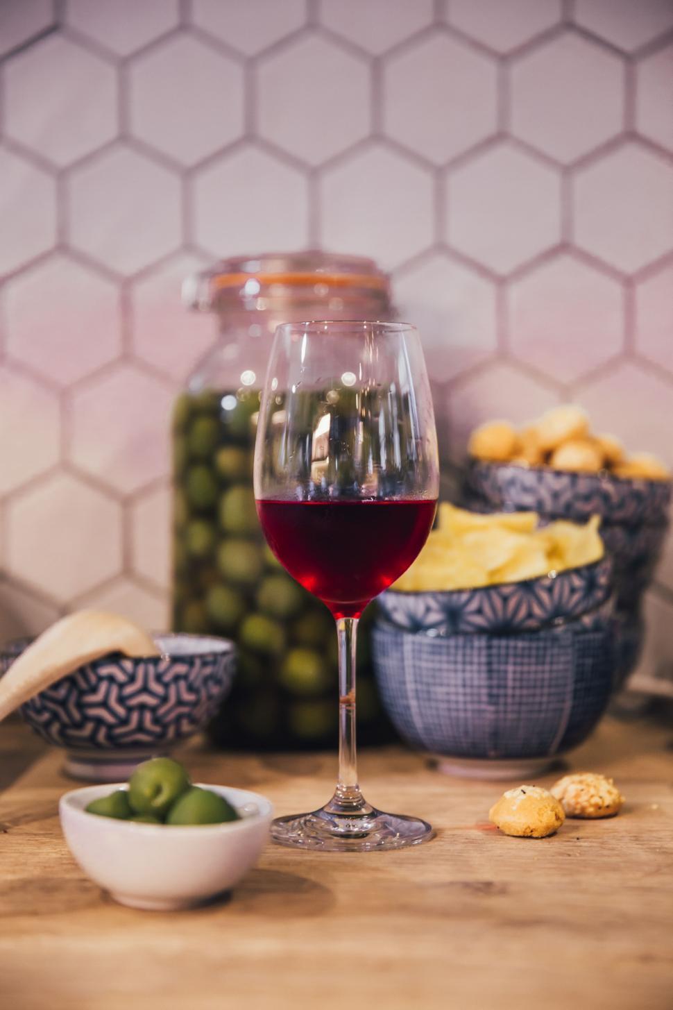 A bowl of mixed green and black olives served as antipasti — the variety and curing method of the olive determines which wine pairs best